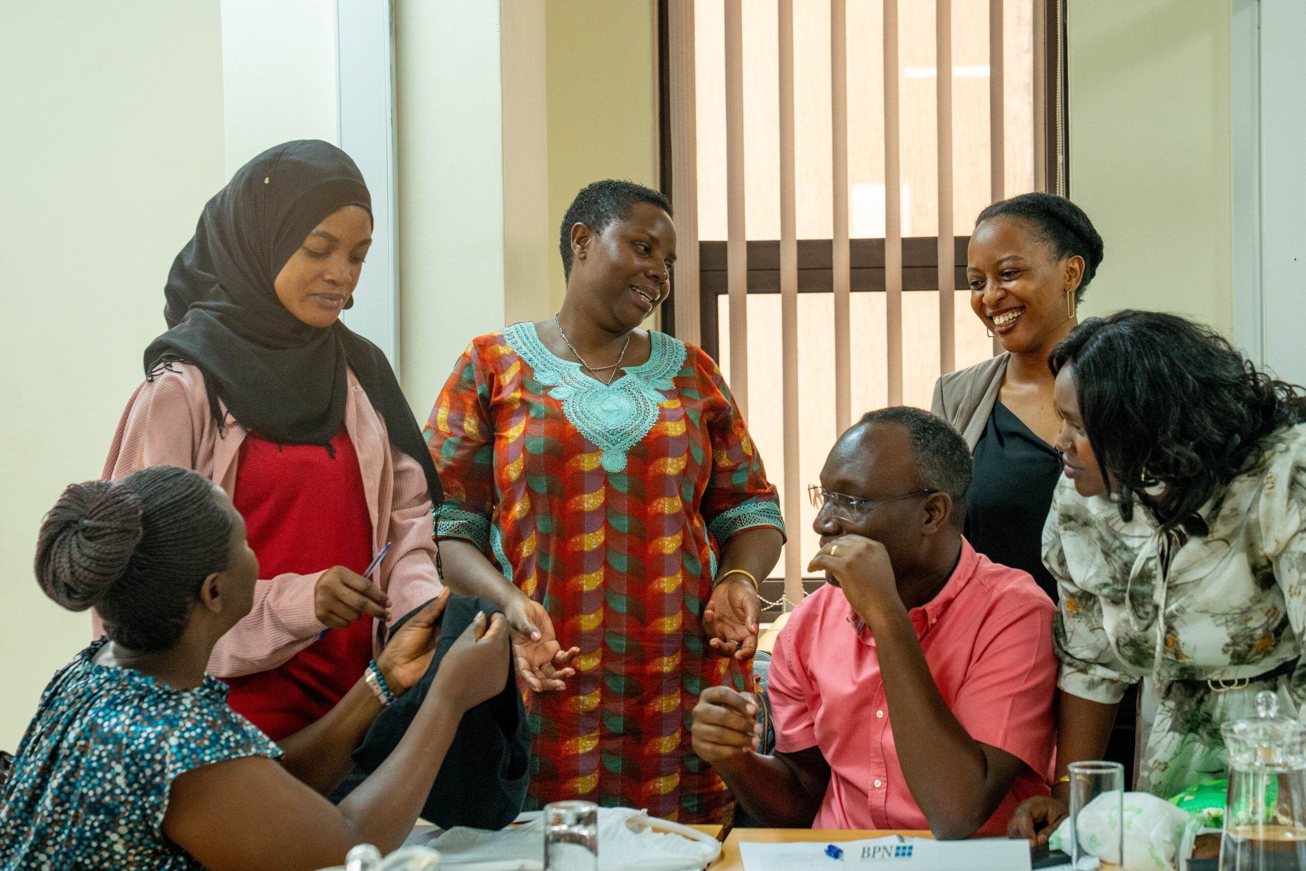 Women participating in business training in Uganda