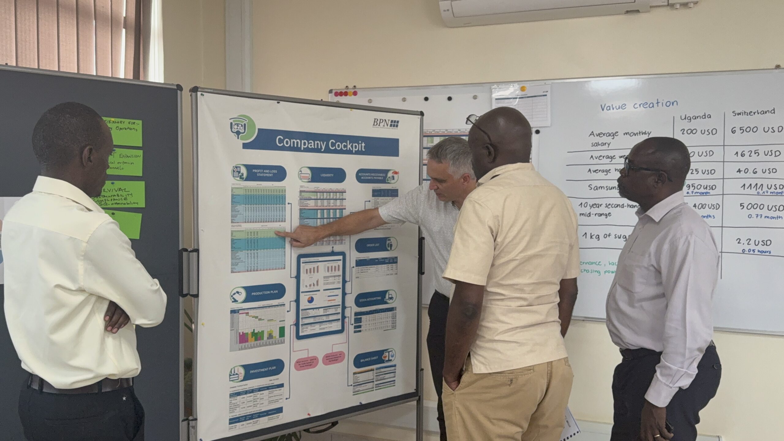Swiss expert Daniel Mather conducting financial management training for Ugandan business leaders